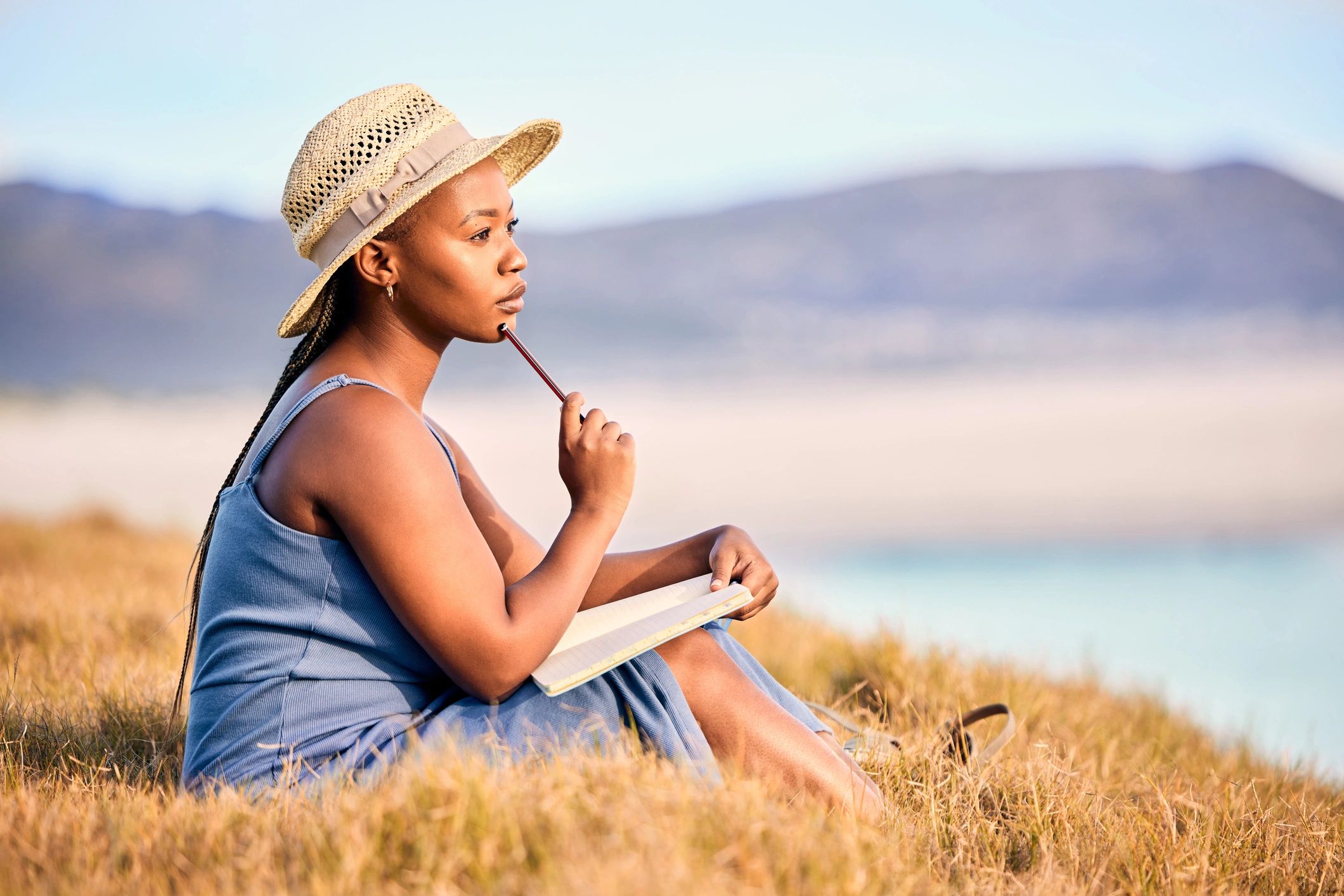 Woman journaling in sunlight